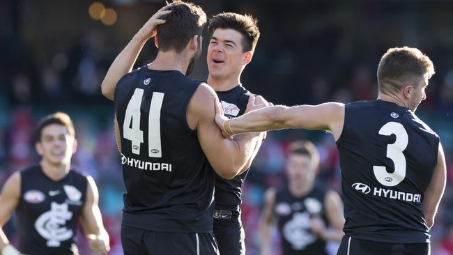 Levi Casboult celbrates a goal with teammates Matthew Kennedy and Marc Murphy. Picture: AAP