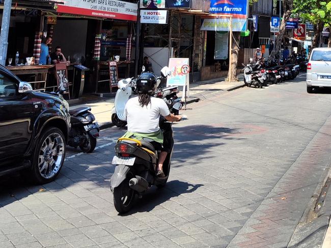 Traffic on the busy Jalan Legian, a main street in Kuta beach, a famous tourist area on the west coast of Bali, Indonesia