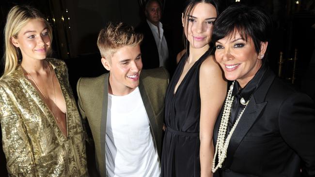 From left: Gigi Hadid, Justin Bieber, Kendall Jenner, and Kris Jenner pose for photographer at the Carine Roitfeld & Stephen Gan celebration of the launch of CR Fashion Book N.5 in Paris, Tuesday, Sept. 30, 2014.(AP Photo/Zacharie Scheurer)