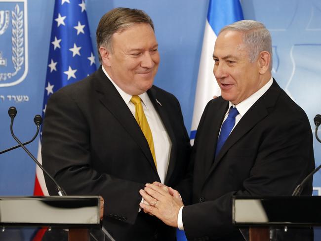 U.S. Secretary of State Mike Pompeo. left. is greeted by Israeli Prime Minister Benjamin Netanyahu ahead of a press conference at the Ministry of Defense in Tel Aviv, Sunday, April 29, 2018. (Thomas Coex, AFP via AP)