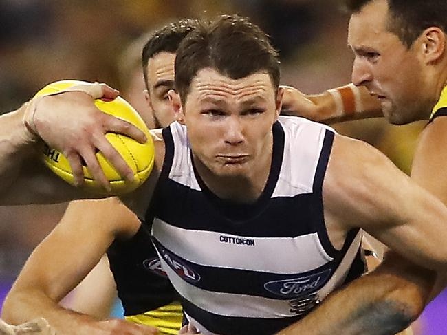 MELBOURNE, AUSTRALIA - SEPTEMBER 20: Patrick Dangerfield of the Cats is tackled by Shane Edwards of the Tigers and Toby Nankervis of the Tigers during the 2019 AFL Second Preliminary Final match between the Richmond Tigers and the Geelong Cats at the Melbourne Cricket Ground on September 20, 2019 in Melbourne, Australia. (Photo by Dylan Burns/AFL Photos)