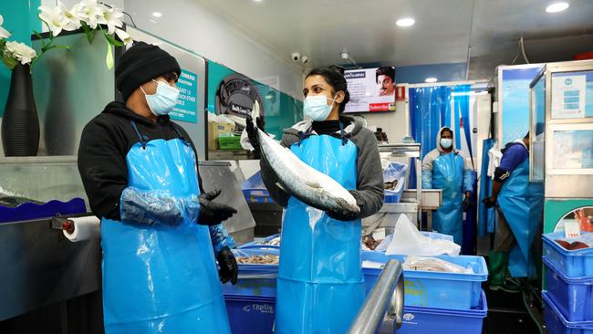 Nidhi Santharan and Sarmi Piratheepan at the Pendle Hill Fish Market, where business is down almost 70 per cent. Picture: Jane Dempster