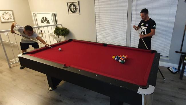 Relaxing with a game of pool.