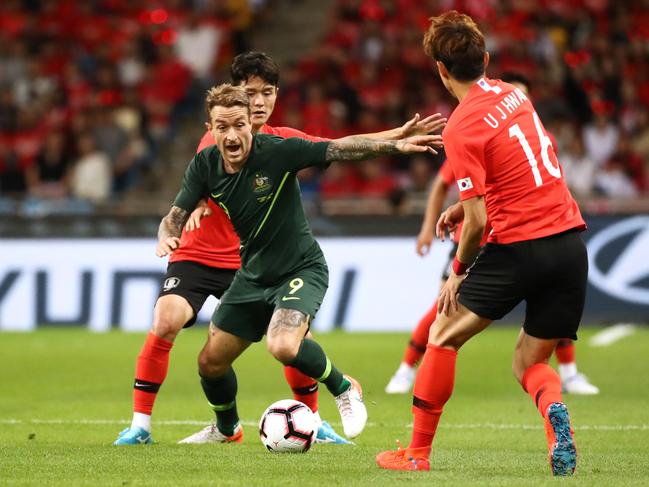 BUSAN, SOUTH KOREA - JUNE 07: Adam Taggart (C) of Australia controls the ball under pressure of Ju Sejong (L) and Hwang Uijo (R) of South Korea during the international friendly match between South Korea and Australia at Busan Asiad Main Stadium on June 7, 2019 in Busan, South Korea. (Photo by Chung Sung-Jun/Getty Images)
