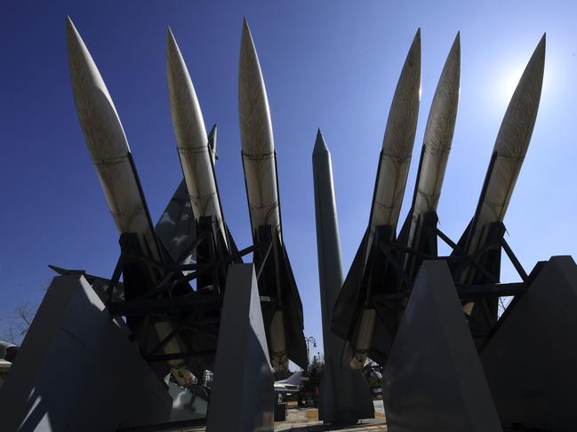 Replicas of a North Korean Scud-B missile (C) and South Korean Hawk surface-to-air missiles are displayed at the Korean War Memorial in Seoul on March 6, 2017. Nuclear-armed North Korea launched four ballistic missiles on March 6 in another challenge to President Donald Trump, with three landing provocatively close to America's ally Japan. / AFP PHOTO / JUNG Yeon-Je
