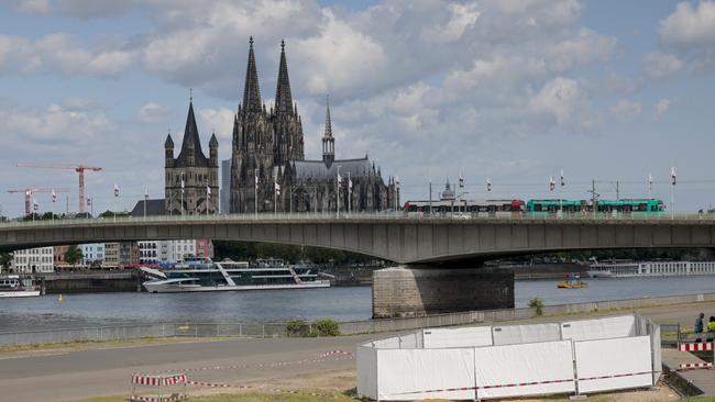 One of the three unexploded bombs from World War II is fenced off with screens as specialists prepare to defuse them in Cologne. Picture: Thomas Banneyer/dpa via AP