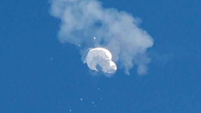 The suspected Chinese spy balloon drifts to the ocean after being shot down off the coast in Surfside Beach, South Carolina in February. Picture: Reuters.