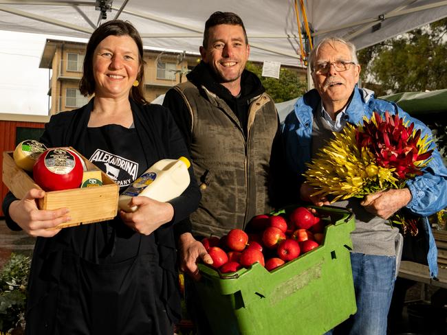 Adelaide Showground Farmers' Market stallholders Rebekah McCaul from Alexandrina Cheese Co, Joel Brockhoff from Pomology at Tarrawood and Bill Cooksley from Rich Pickings Flowers, Wayville, Kaurna Yarta, Sunday, August 14, 2022. (The Advertiser/ Morgan Sette)