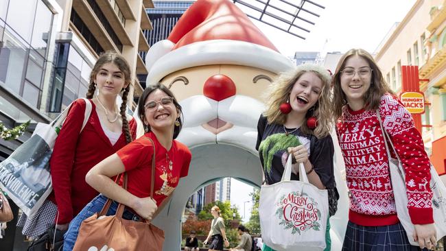 BRISBANE AUSTRALIA - NewsWire Photos DECEMBER 23, 2022: Friends (left to right) Ashlee Palmer, Phoebe Sultana, Neve Francis and Brydi-Rose Peters in the Queen Street Mall. The mall is busy with shoppers 2 days before Christmas.  NewsWire / Sarah Marshall