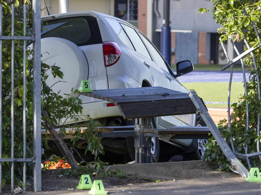 The car sits inside the gate of the school after the crash. Picture: Wayne Taylor