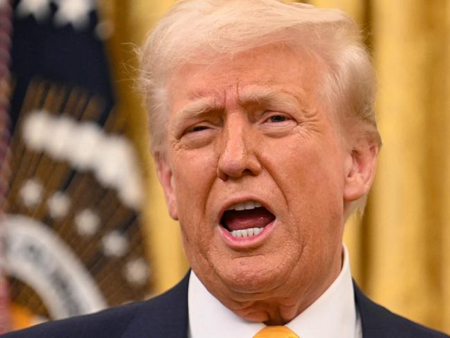 US President Donald Trump speaks during a ceremonial swearing-in for US Secretary of Commerce Howard Lutnick in the Oval Office of the White House in Washington, DC, on February 21, 2025. (Photo by Jim WATSON / AFP)