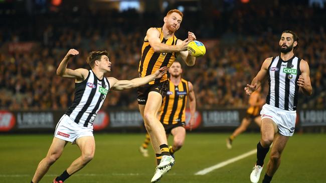 Conor Glass attacks the footy in Hawthorn’s win over Collingwood on Friday night. Picture: Julian Smith (AAP).