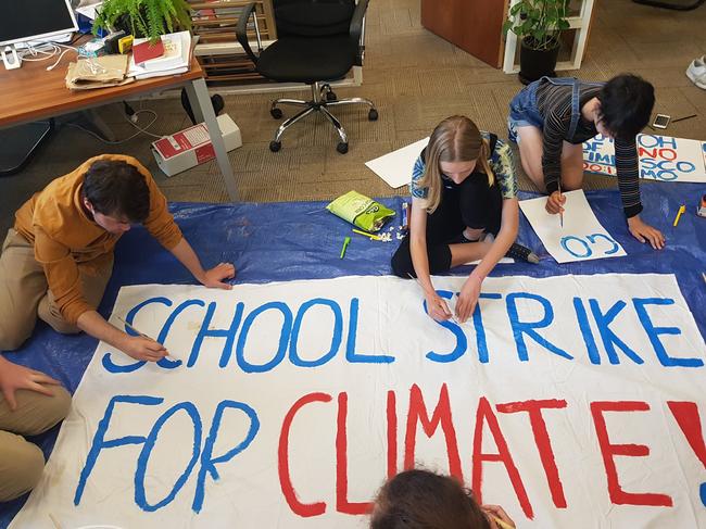 Children being taught to make protest posters and banners by the AYCC NSW at their Redfern Headquarters before the previous Student Strike last November. Picture: Facebook