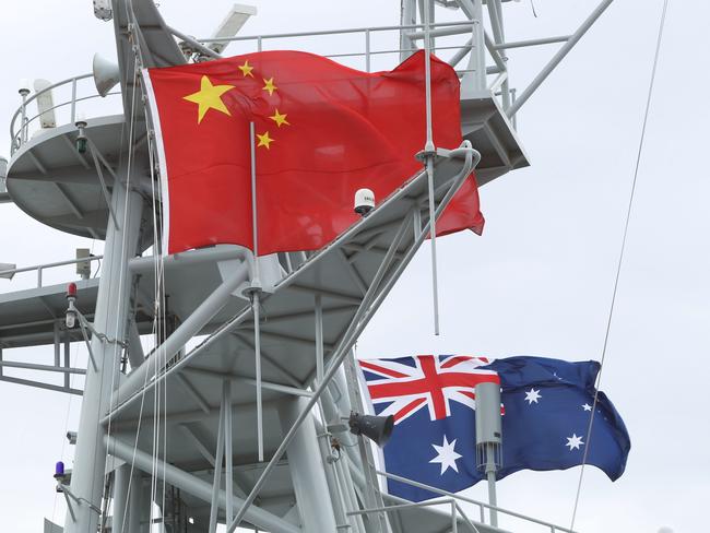 Chinese Naval ships docked at Garden Island in Sydney. With the Australian and Chinese flags flying.