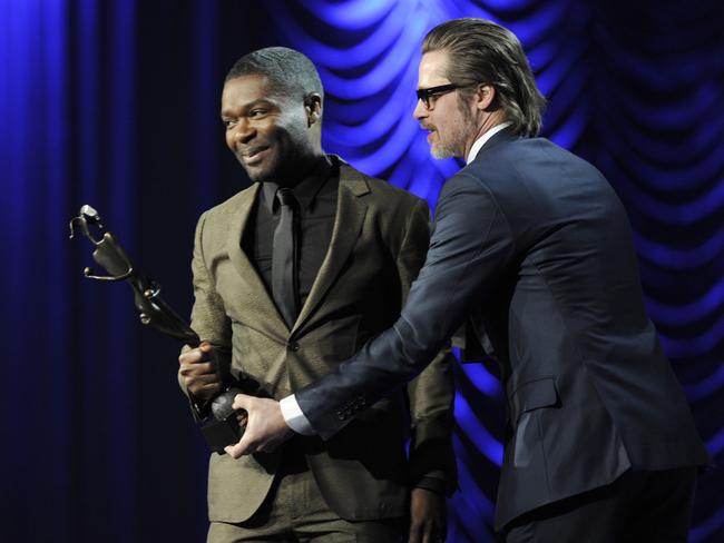 Pitt presents the breakthrough performance award — actor to David Oyelowo for Selma.