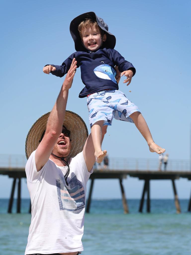 Bendigo father Ash Sim with son Noah, 3, at Glenelg. Picture Dean Martin