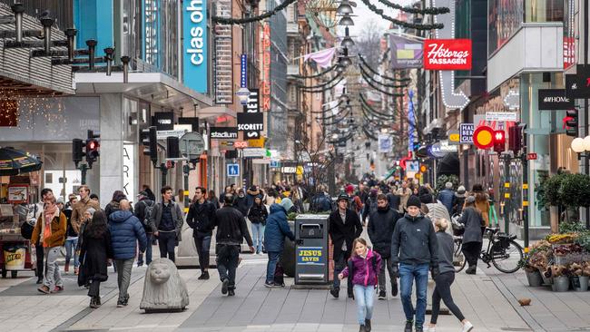 People stroll at the Drottninggatan shopping street in central Stockholm. Picture: AFP