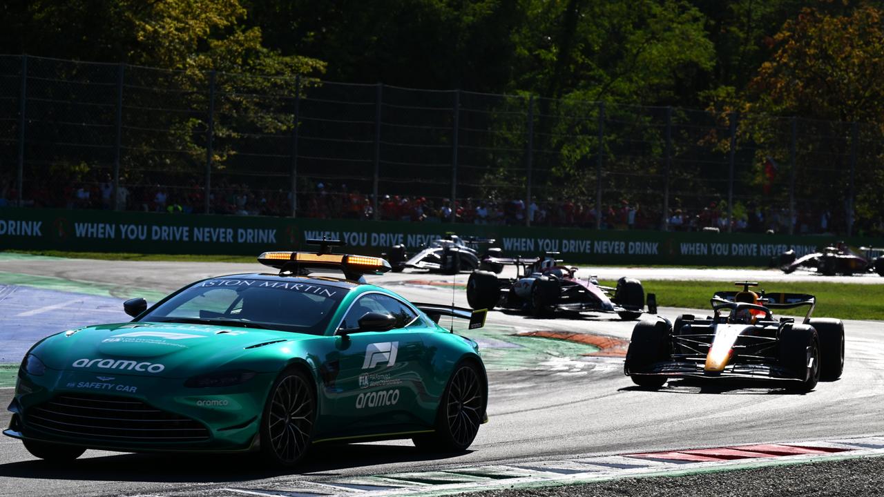 MONZA, ITALY - SEPTEMBER 11: The FIA Safety car leads Max Verstappen of the Netherlands driving the (1) Oracle Red Bull Racing RB18 and the rest of the field during the F1 Grand Prix of Italy at Autodromo Nazionale Monza on September 11, 2022 in Monza, Italy. (Photo by Clive Mason/Getty Images)