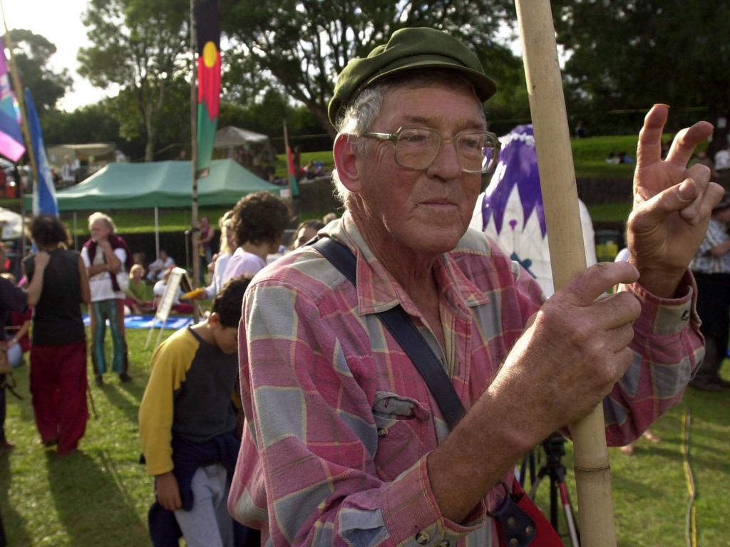 Like old times, 59 yr old original Hippie Harry Anning of Nimbin, gives a arthritic peace sign to his friends, as hippies converge at Tha Channon for a 30th anniv. of the Aquarius Festival near Nimbin NSW. pic Lyndon Mechielsen 11/5/03