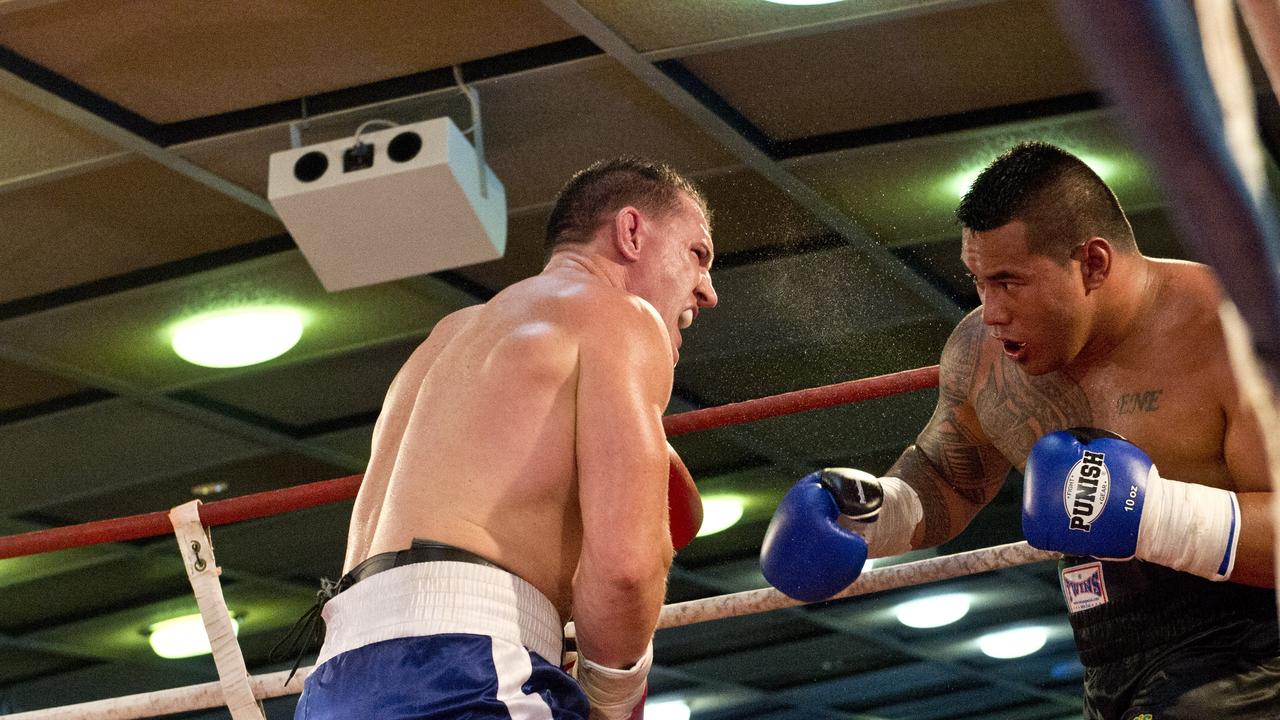 Paul Gallen and Herman Ene-Purcell fight it out in Toowoomba. Friday, Jan 29, 2016.