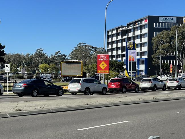 Traffic banked up for several hundred metres at Tuggerah on Monday with cars waiting to get into the drive through Covid testing clinic at the Mariners Centre of Excellence. Picture: Richard Noone