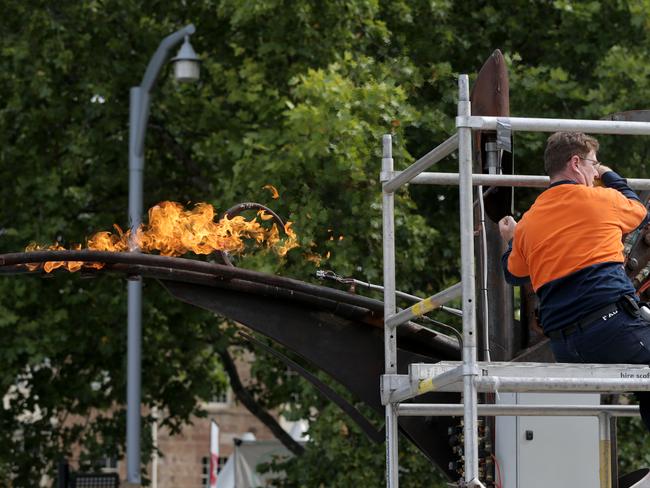 Some last-minute testing on the flame breathing sculpture at the entreance to the Taste of Tasmania.