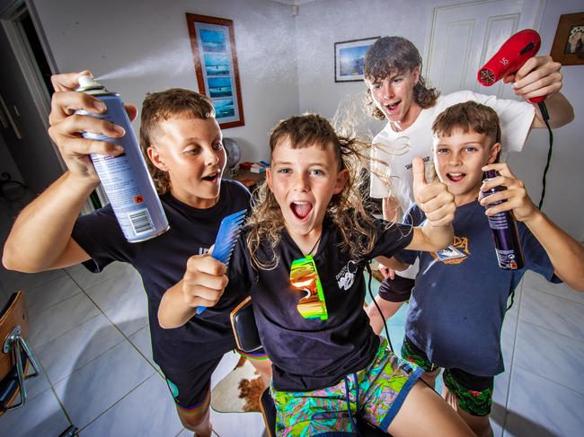 **** WEEKEND PAPERS ***** Elijah Gunn, 8, celebrates winning the best mullet with his siblings Kayden, 13, Macalister,15 and Braithan, 10.Picture: Nigel Hallett