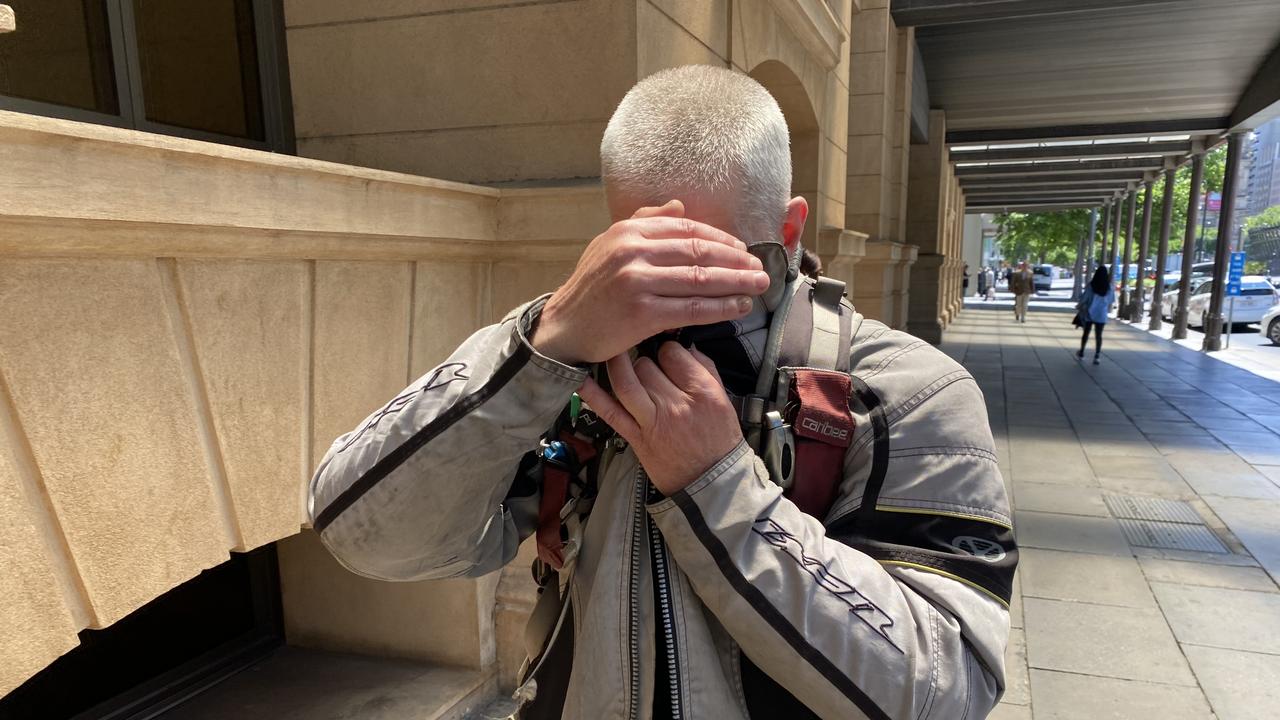 Philip Allen Jones covered his face as he left court after the sentencing. Picture: NCA NewsWire/Kathryn Bermingham