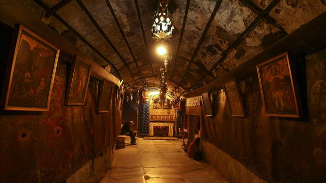 The deserted Grotto, in the Nativity Church in Bethlehem is pictured empty ahead of Christmas amid ongoing battles in the Gaza Strip. Picture: Hazem Bader/AFP