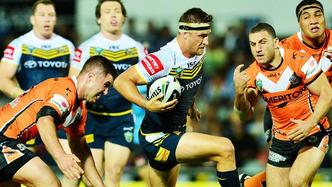 The North Queensland Cowboys v West Tigers from 1300 Smiles Stadium. Cowboys Tariq Sims gets pass Tigers Curtis Sironen and Robbie Farah.. Picture: Zak Simmonds