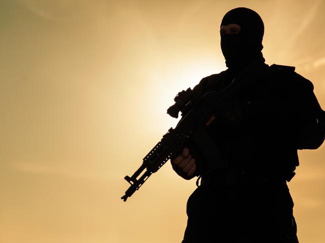 Silhouette of special forces operators with weapons