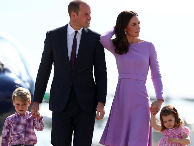 Prince William and Kate, the Duchess of Cambridge, walk with their children Prince George and Princess Charlotte as they visit helicopters at the Airbus compound in Hamburg. Picture: Christian Charisius/AFP