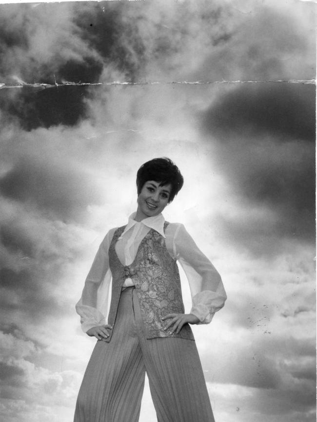1969: Wills in red-pleated flares with a gold brocade vest and blouse. September 1969. Photo: News Corp.