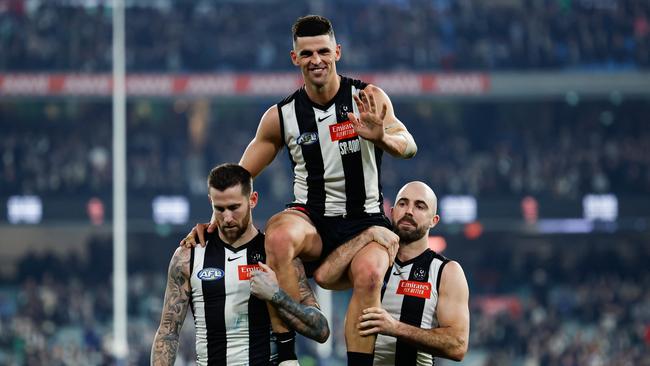 Pendlebury says he ‘felt the love’ from Collingwood supporters as he was chaired off by Jeremy Howe (left) and Steele Sidebottom (right) after his 400th game. Picture: Dylan Burns / Getty Images