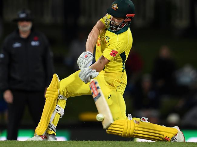 Australia's Shaun Marsh drives a delivery during the third one-day international cricket match in Hobart. Picture: AFP