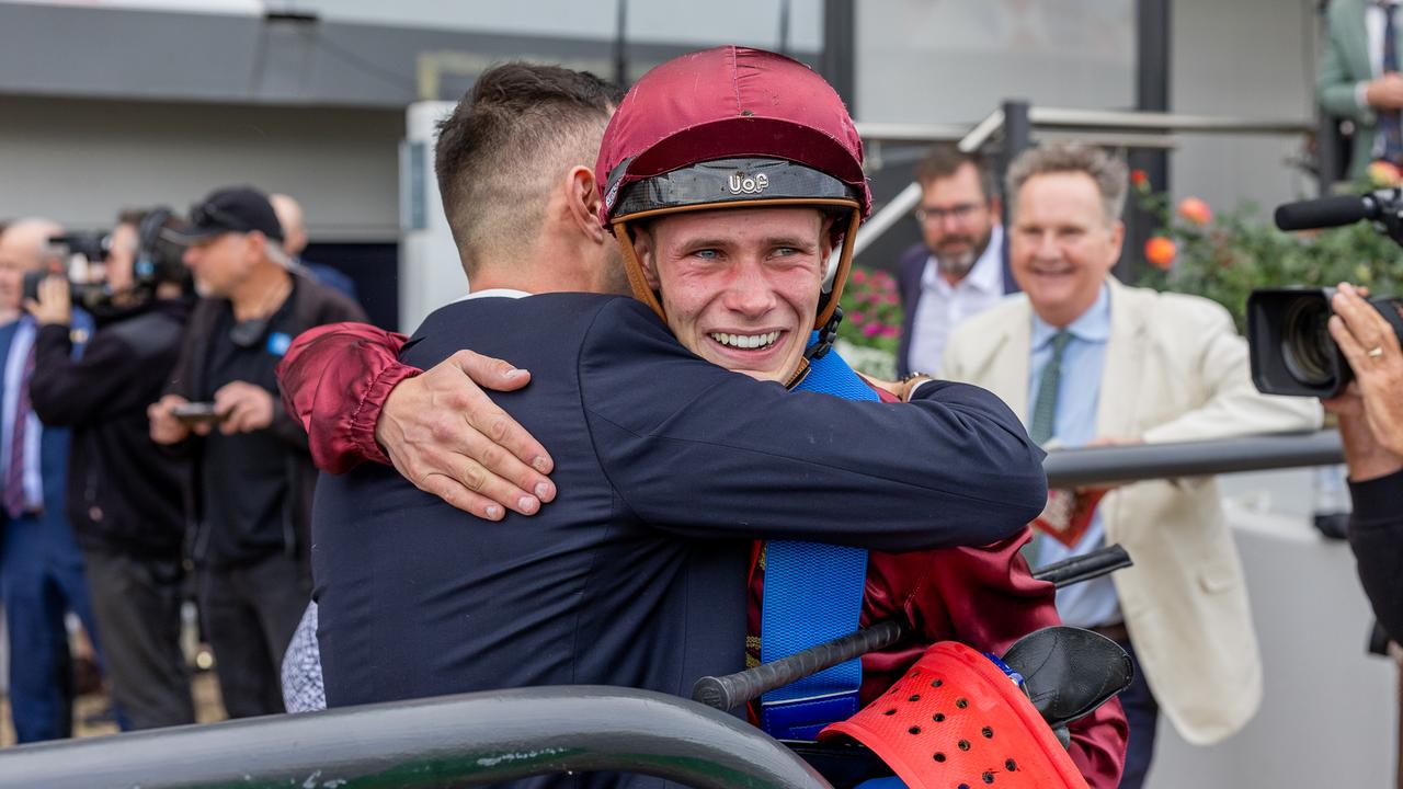 Lachlan Neindorf and Tommy Stokes share a hug following Climbing Star's win in the Robert Sangster Stakes at Morphettville. Picture: Makoto Kaneko