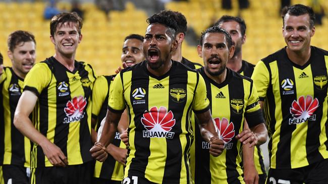 A fired-up Roy Krishna of the Phoenix, centre, celebrates scoring a goal against the Brisbane Roar. Picture: AAP