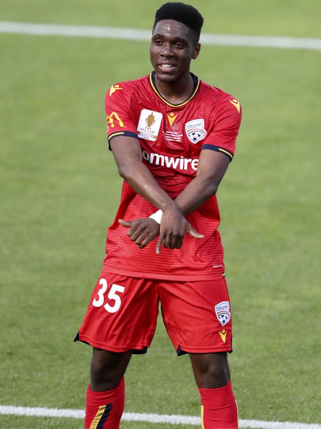 Adelaide United forward Al Hassan Toure celebrates his opening goal in the FFA Cup final win over Melbourne City. Picture: Sarah Reed