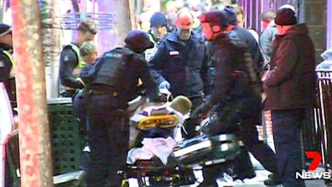 The wounded persons are taken to hospital from Inflation nightclub on King St.