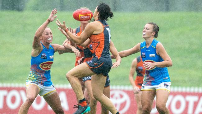 Bec Privitelli grabs the award-winning mark in heavy rain during the Giants’ opening round win over Gold Coast at Blacktown. Picture: Narelle Spangher