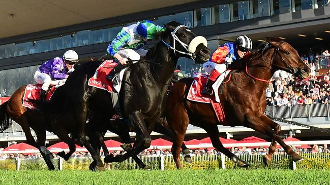 Bella Nipotina (black cap) beats I Wish I Win in the Group 1 Doomben 10,000. Picture. Grant Peters/Trackside Photography.