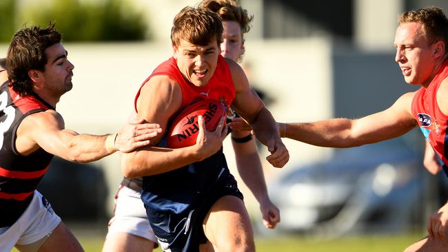 Old Brighton’s Harry Hynes bursts through the pack. Picture: Josh Chadwick