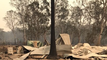 Jamie Zaia and Anita Reeves bushfire ravaged property at Willawarrin was allegedly caught up in a bushfire business grants scam. Supplied.