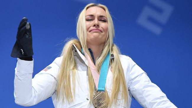 Lindsey Vonn cries on the podium as she receives her bronze medal for the women’s downhill event. Photo: AFP