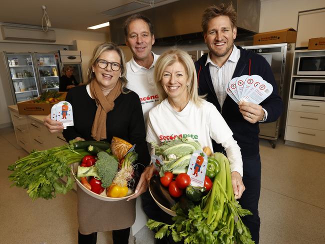 Second bite Winter Appeal launch.Curtis Stone in the kitchen with volunteer cooks cooking breakfast for ADRA clients (people affected by homelessness). SecondBite CEO Steve Clifford, Penny Fowler, Curtis Stone and SecondBite co-founder Simone Carson.   Picture: Alex Coppel.