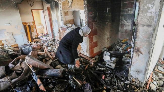 People inspect the damage to their homes following Israeli air strikes on February 10, 2024 in Rafah, Gaza. Picture: Ahmad Hasaballah/Getty Images