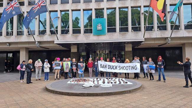 The Coalition Against Duck Shooting protesters outside of Premier Jacinta Allan's office.