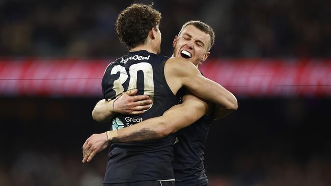 MELBOURNE, AUSTRALIA – AUGUST 12: Charlie Curnow of the Blues (L) celebrates with Patrick Cripps of the Blues after kicking a goal during the round 22 AFL match between Carlton Blues and Melbourne Demons at Melbourne Cricket Ground, on August 12, 2023, in Melbourne, Australia. (Photo by Daniel Pockett/Getty Images)