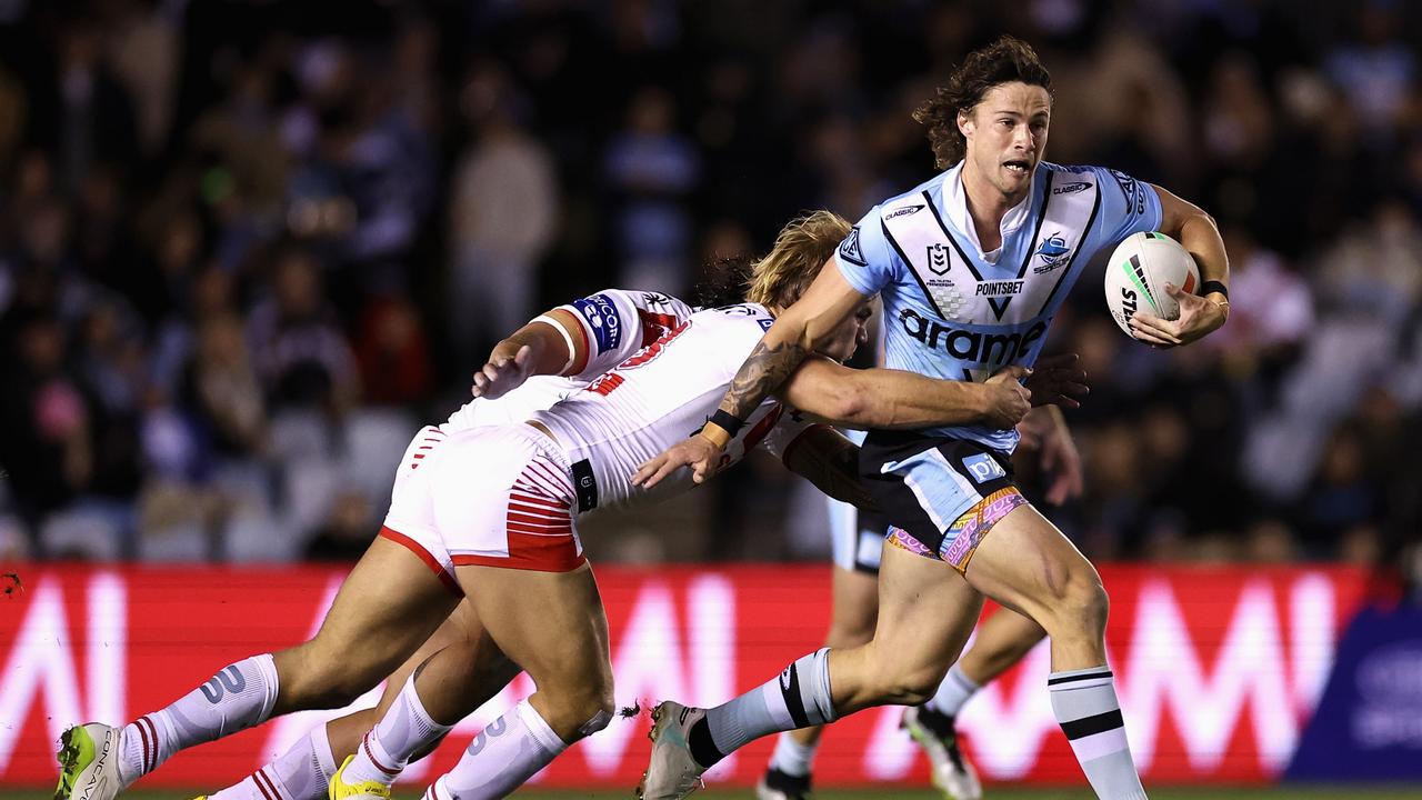 SYDNEY, AUSTRALIA - JUNE 29: Nicholas Hynes of the Sharks is tackled during the round 18 NRL match between Cronulla Sharks and St George Illawarra Dragons at PointsBet Stadium on June 29, 2023 in Sydney, Australia. (Photo by Cameron Spencer/Getty Images)