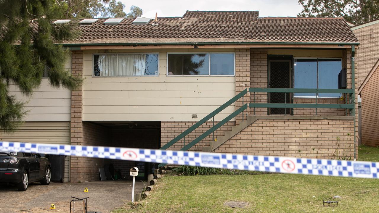 A number of evidence markers have been laid outside an Ambarvale home after a woman was fatally shot in a drive by. Picture: Julian Andrews